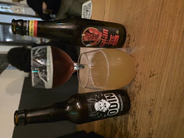 A bottle of hydromel and a bottle of beer on a table in Cordoba, Spain