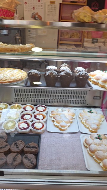 A pastry case with assorted desserts at Sensibles's Bakery in Cordoba, Spain