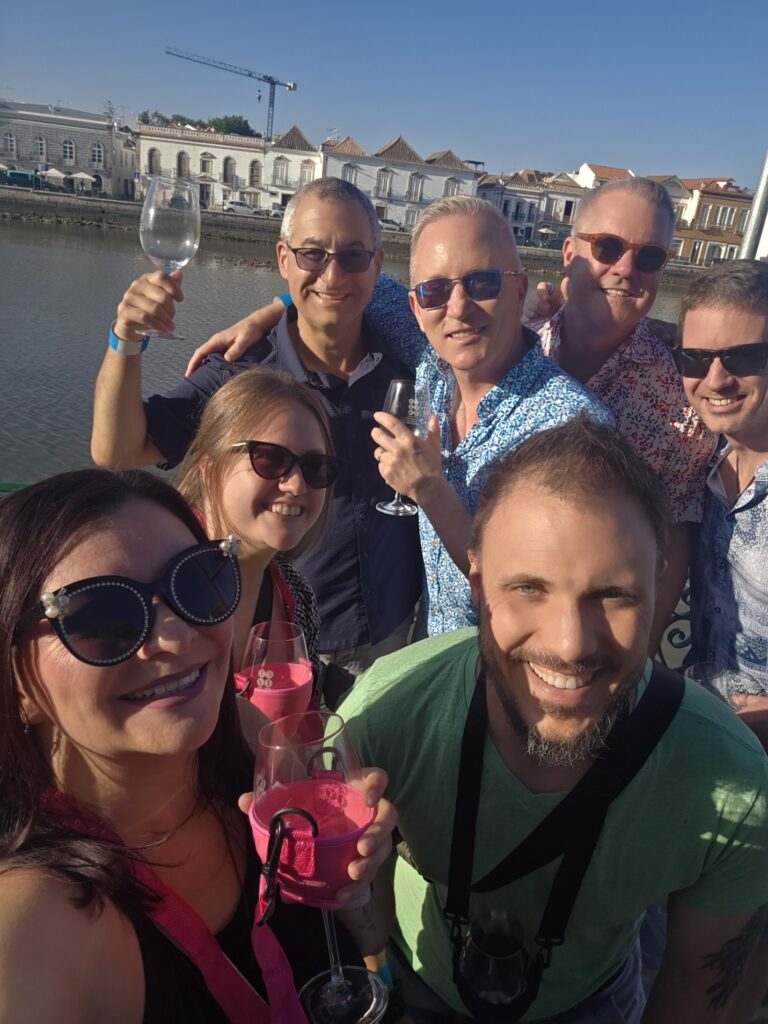 A group of friends taking a selfie with wine glasses